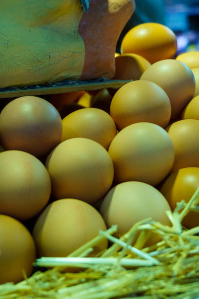istock Fresh white and brown eggs at the market 1295592136