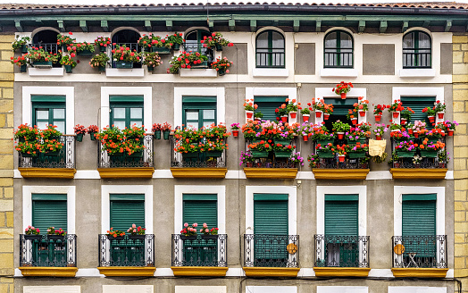 Plaza de Hondarribia, traditional houses and balconies with flowers in the Basque Country in summer