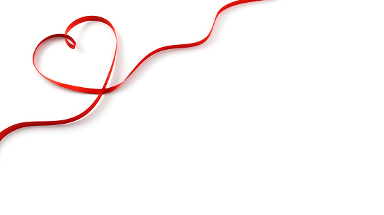 Heart Shaped Red Ribbon on White Background