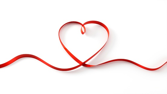 Heart Shaped Red Ribbon on White Background