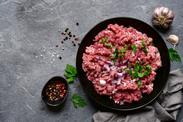 istock Homemade beef or pork minced meat in a black bowl 1295593463