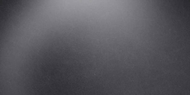 istock Black brushed metal wall, abstract texture background 1295594459