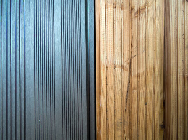 istock Wooden and polymer decking boards stand side by side 1295598402