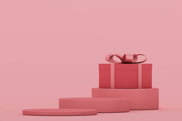 istock Pink gift boxes on pink stands, valentines day concept 1295599807