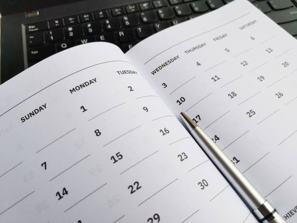 istock Calendar With Date Notebook And Pen For Planning 1295601041