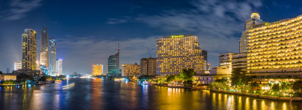 istock Bangkok luxury hotels Chao Phraya waterfront illuminated night panorama Thailand 1295603933