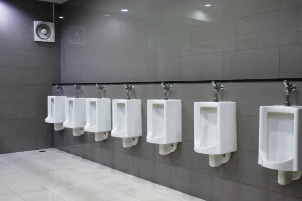 istock White many urinal on grey ceramic wall toilet. 1295604104