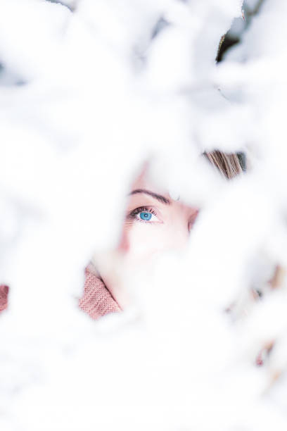 freezing woman in heavy snowfall suffering from winter depression