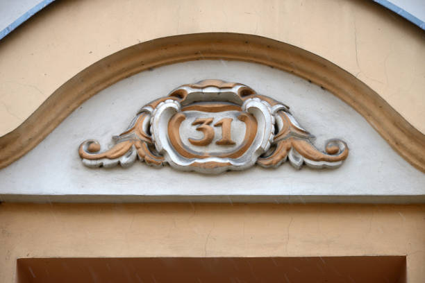 House number 31 as element of decoration on old building