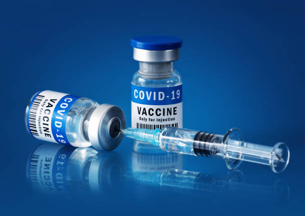 istock COVID-19 vaccine and syringe 1295606284