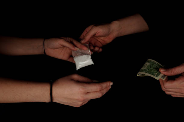 hand of addict woman with buying dose of cocaine from drug dealer. - passion women human hand macro imagens e fotografias de stock