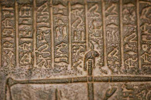 istock Egyptian hieroglyphs on a historic replica. 1295608398