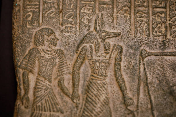 Shallow depth of field (selective focus) and close up footage with Egyptian hieroglyphs on a historic replica.
