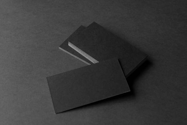 istock Business card on black background. 1295609126