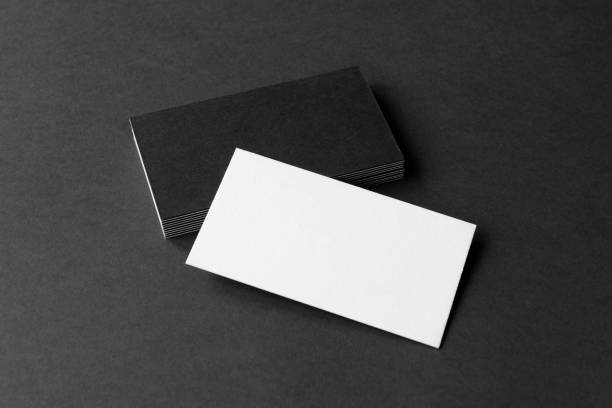 istock Business card on black background. 1295609134