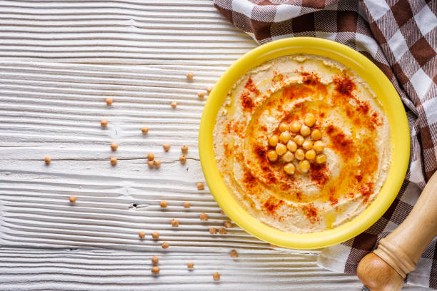 istock traditional turkish hummus on a white wooden rustic background 1295609635
