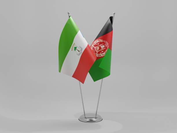 istock Afghanistan - Equatorial Guinea Cooperation Flags, White Background - 3D Render 1295610342