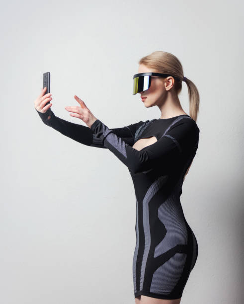 istock android female in VR glasses and mobile phone on white background. 1295610908