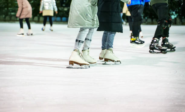 istock People ice skating on the ice rink in winter. 1295615595