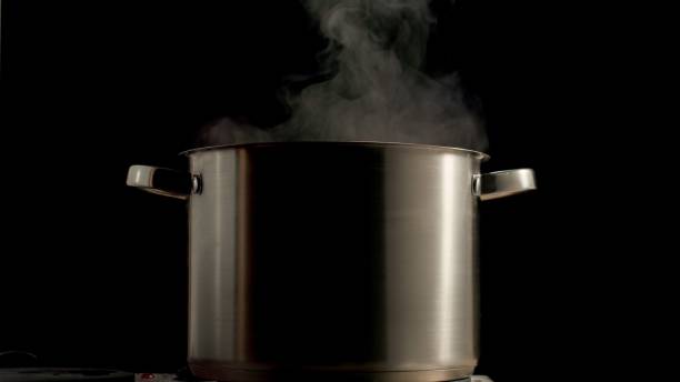 istock Large Saucepan Boiling With Steam 1295615625