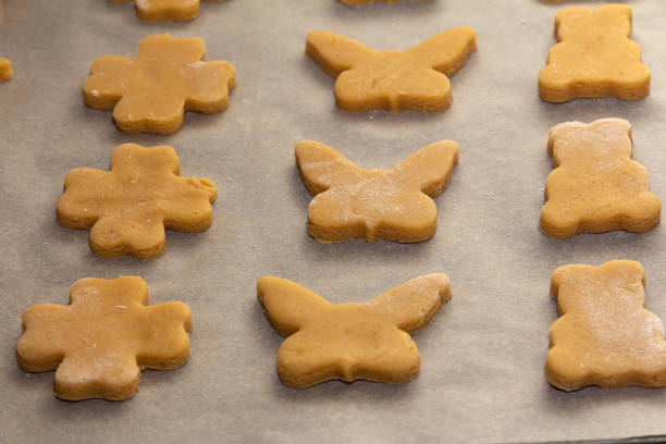 istock Raw curly cookies on a baking sheet 1295615869