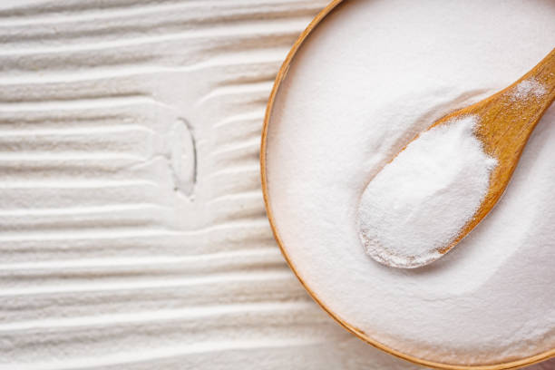 istock baking soda powder on wooden rustic background background 1295617136
