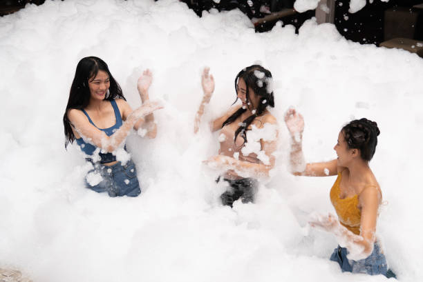 istock Girl playing in bubble pool with fun and joy 1295620316