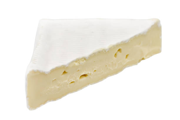 istock Camembert or brie cheese isolated on white background. Soft cheese covered with edible white mold view from above. 1295624591