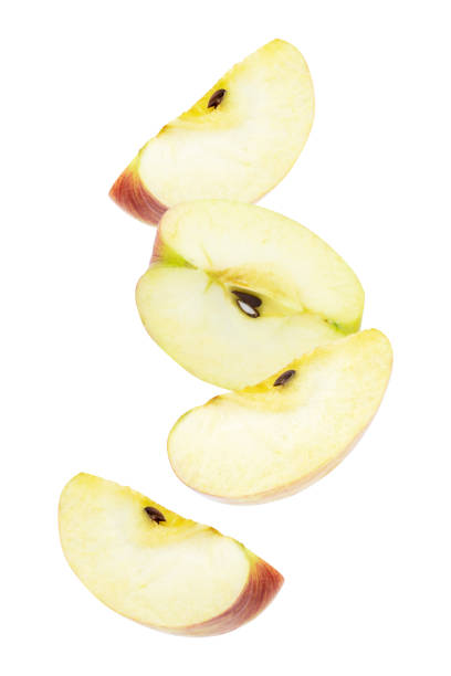 istock Falling pieces of ripe apples fruit isolated on white background 1295625732