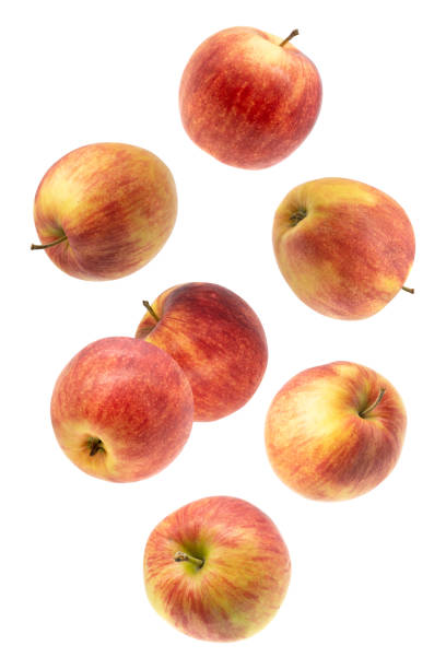 istock Falling red juicy apple isolated on white background 1295625913