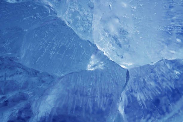 istock beautiful blue ice with cracks. frosty background 1295626807