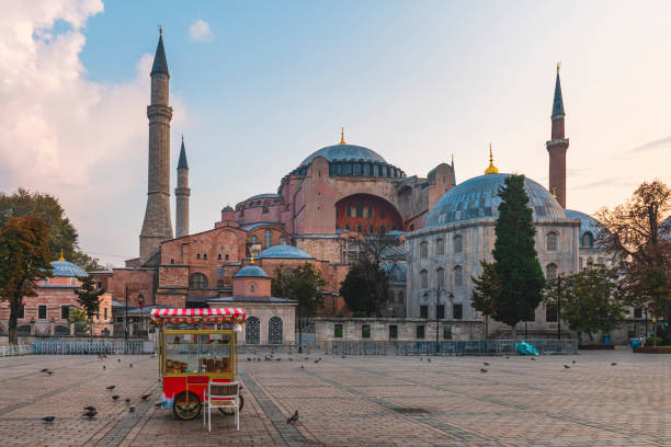 Beautiful view on Hagia Sophia in Istanbul, Turkey with simit cart on empty square on sunrise Beautiful view on Hagia Sophia in Istanbul, Turkey with simit cart on empty square on sunrise. Travel destination historic heritage square phoenix stock pictures, royalty-free photos & images