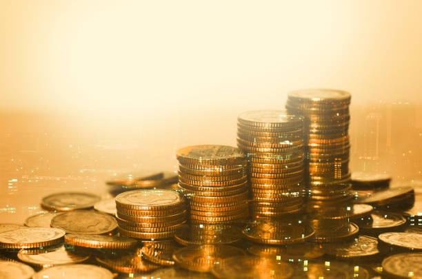 istock row of coin stack with double exposure night city background for financial banking and saving money and business stock investment concept. 1295628583