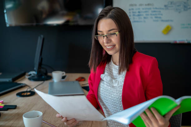 istock Young concentrated girl working on laptop 1295628671
