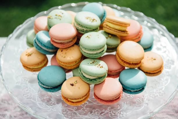 istock Macarons in various colors on glass plate 1295630318