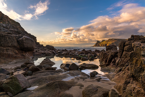 The beauty of clouds reflected in rockpools in the Cornish coast