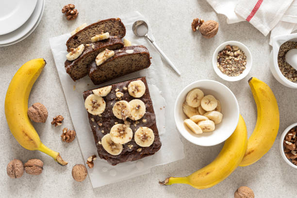 istock Banana bread cooking on kitchen table, top view 1295632119