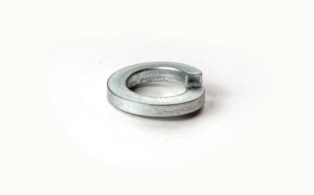 istock metal spring washer lies isolated on white background 1295633564