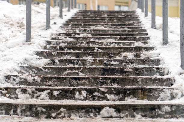 Snow-free concrete ladder (it continues to snow)