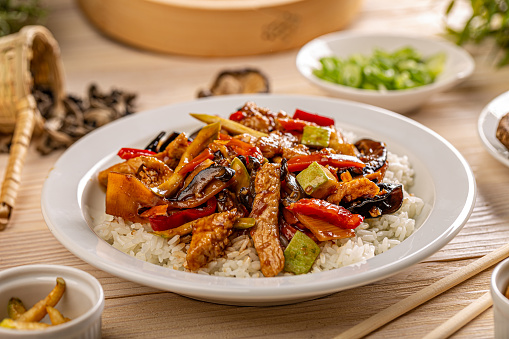 Asian food menu spicy chicken stripes with vegetables and jelly ear served with rice