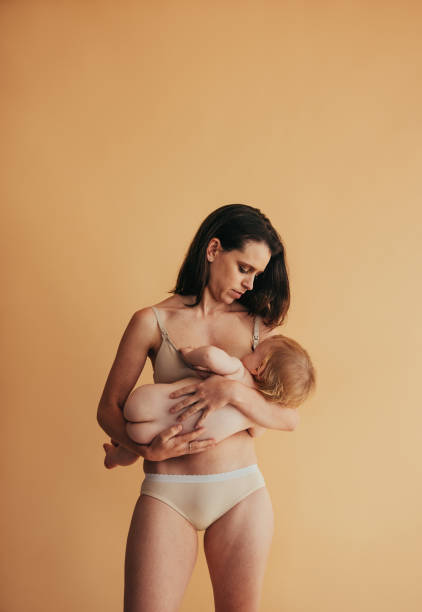 istock Woman feeding her baby 1295638579