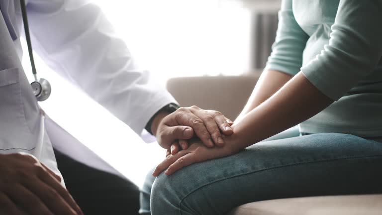 Male Doctor wear uniform Holding hand of patient, Slow motion