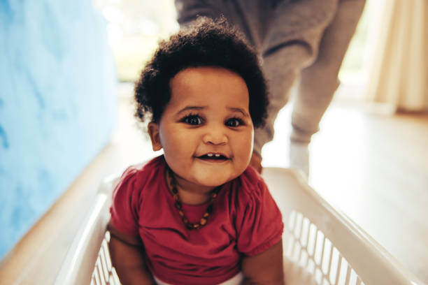 istock Cute baby enjoying playing at home 1295639651