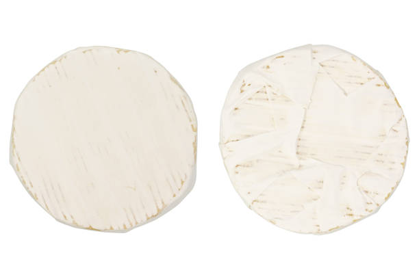 istock Camembert or brie cheese isolated on white background. Soft cheese covered with edible white mold view from above. 1295642972