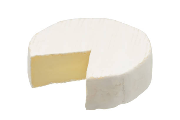 istock Camembert or brie cheese isolated on white background. Soft cheese covered with edible white mold view from above. 1295642992