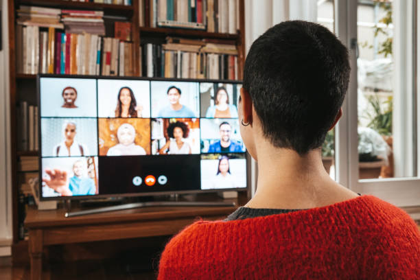 istock Woman in front of a device screen in video conference 1295647389