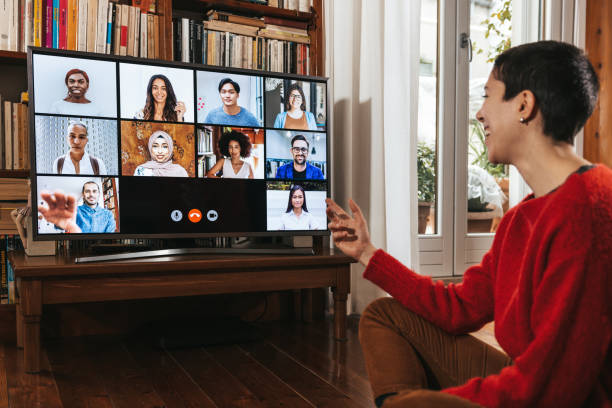 istock Woman in front of a device screen in video conference 1295647500