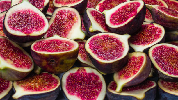 istock Tasty figs background. Top view. 1295650323
