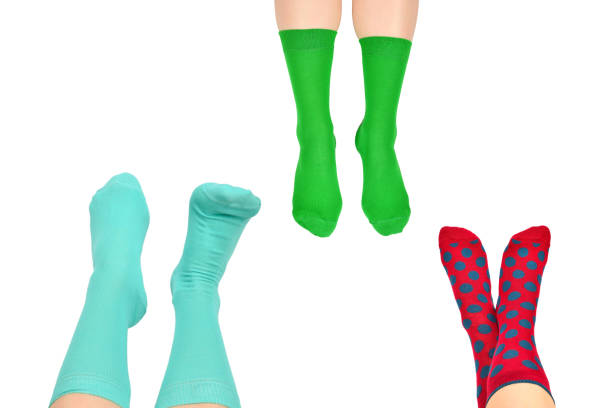 istock Woman in blue socks isolated on white background. Top view. 1295650433