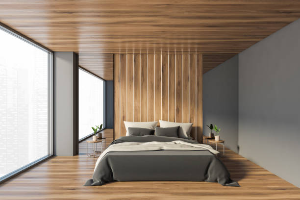 istock Gray and wooden master bedroom 1295653057